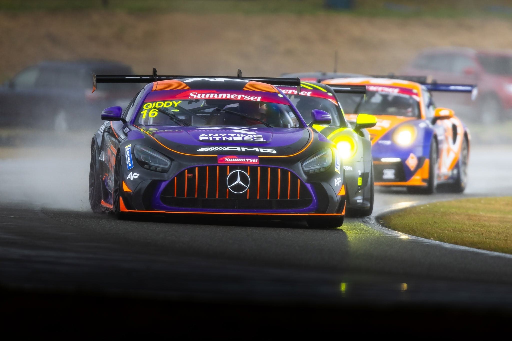 A GT4 Mercedes-AMG powers through the rain